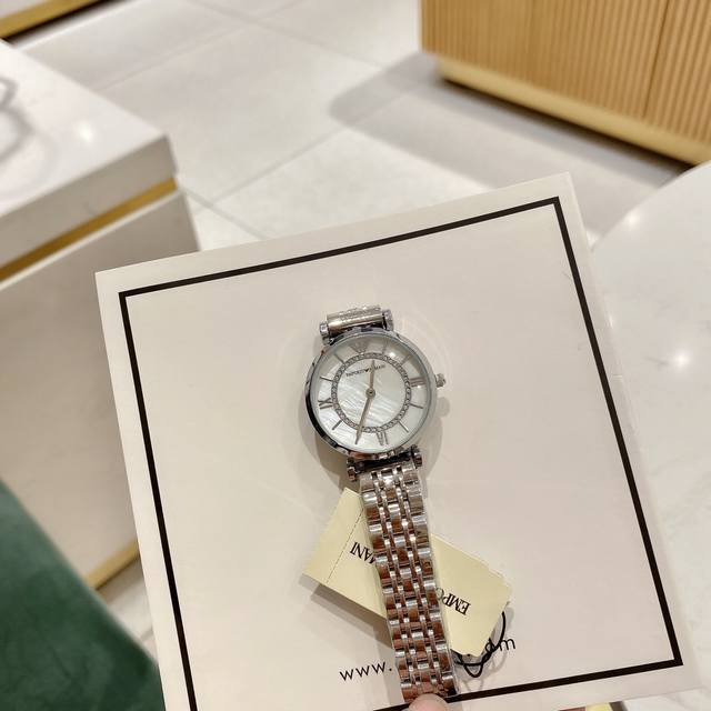 Armani Model: Ar1909 Case: 316L Stainless Steel Mirror: Reinforced Mineral Glass Strap: 316L Diameter Size: 32mm * Brilliant and Exquisite dial with perfect fusion of rhinestones and mother of pearl shimmering on the wrist: