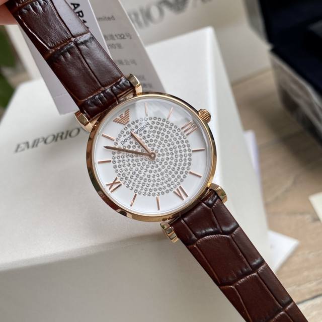 Original order new to Armani quartz women's watch. Versatile and stunning, with a starry dial that sparkles with extraordinary brilliance. Paired with a double needle design and a calf leather strap, the delicate grain adds an elegant and fashionable