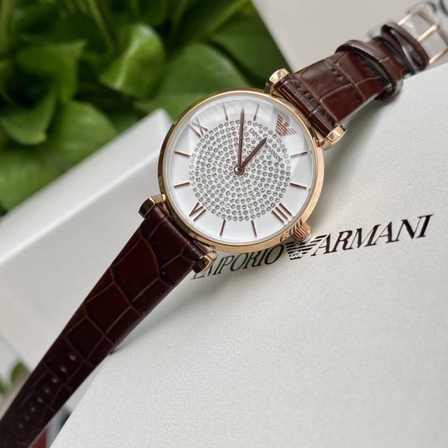 Original order new to Armani quartz women's watch. Versatile and stunning, with a starry dial that sparkles with extraordinary brilliance. Paired with a double needle design and a calf leather strap, the delicate grain adds an elegant and fashionable