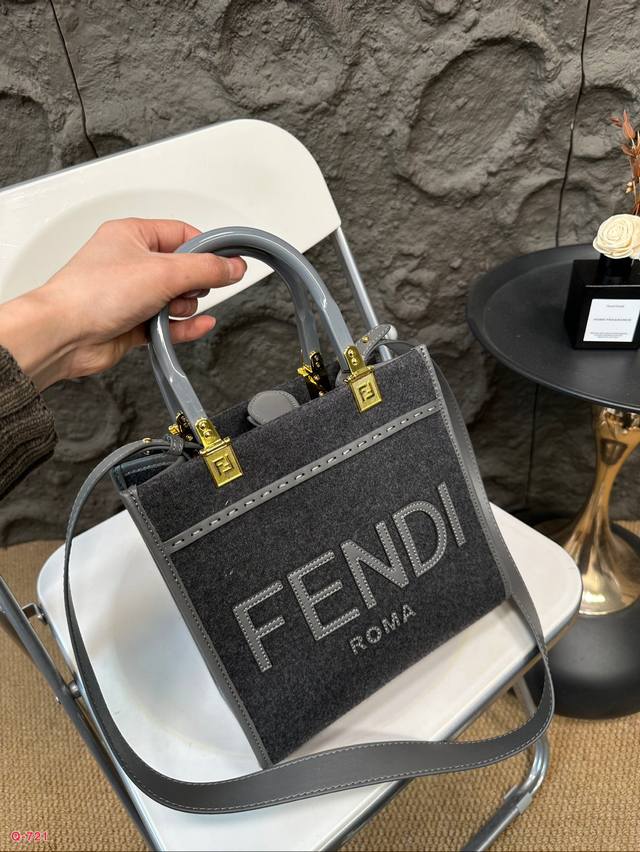 Fendi woolen mini tote bag of the same price, printed with brown ff jacquard pattern and light brown leather Fendi Roma logo, with hard leather handle. Featuring spacious interior compartments with light brown leather edges and gold accents: