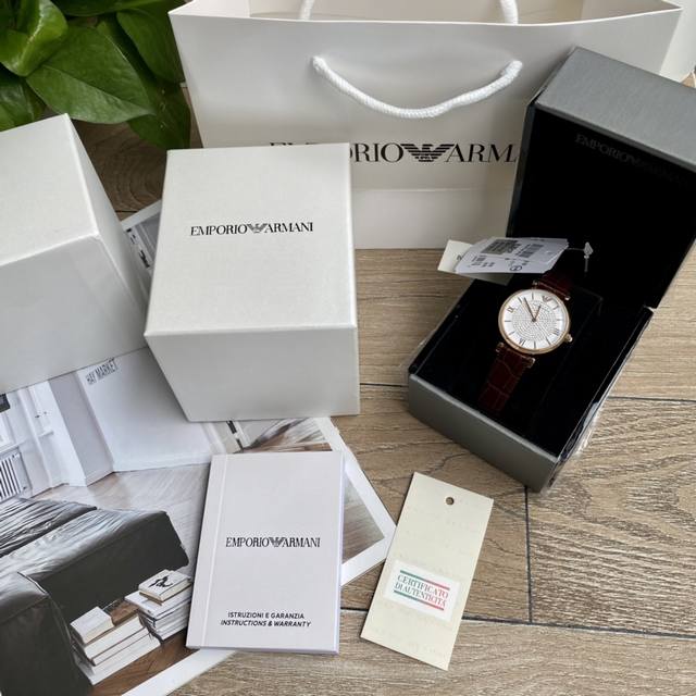 Original order new to Armani quartz women's watch. Versatile and stunning, with a starry dial that sparkles with extraordinary brilliance. Paired with a double needle design and a calf leather strap, the delicate grain adds an elegant and fashionable